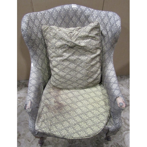 2374 - A Victorian drawing room chair with shaped outline, upholstered finish, raised on scrolled cabriole ... 