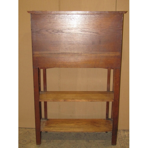 2447 - An Arts & crafts slim oak bureau bookcase combination with pierced detail, 82 cm wide x 30 cm deep x... 