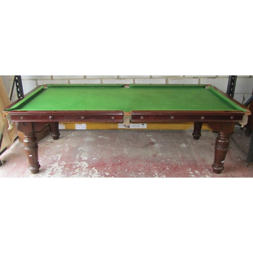 2661 - A late 19th century mahogany snooker table/dining table, the slate base raised on four turned and fl... 