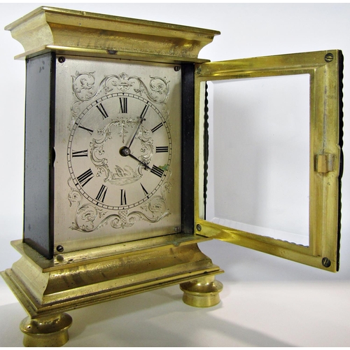 1486 - A late Georgian mantel clock the rectangular engraved silvered dial with scrolling flowers, to the c... 