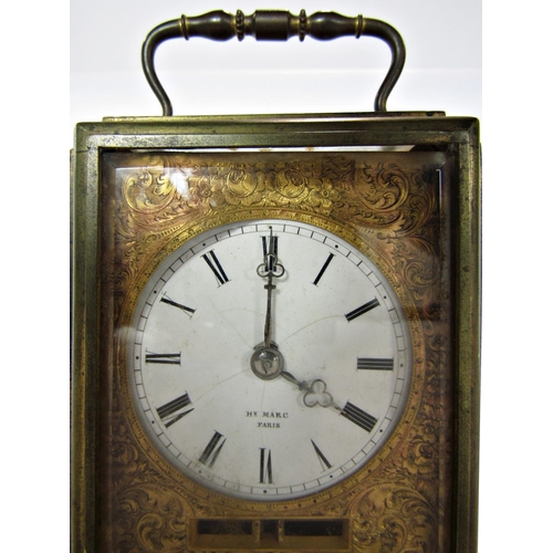 1487 - a late 19th century French eight day carriage clock with circular enamel dial set within a chased ma... 