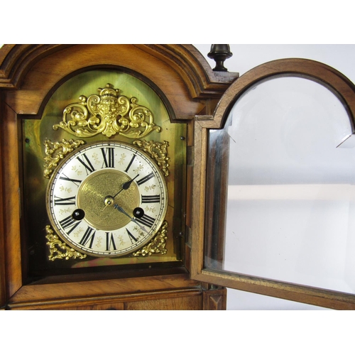 1489 - A late 19th century German bracket clock with walnut case, broken arch dial and Ting Tang strike