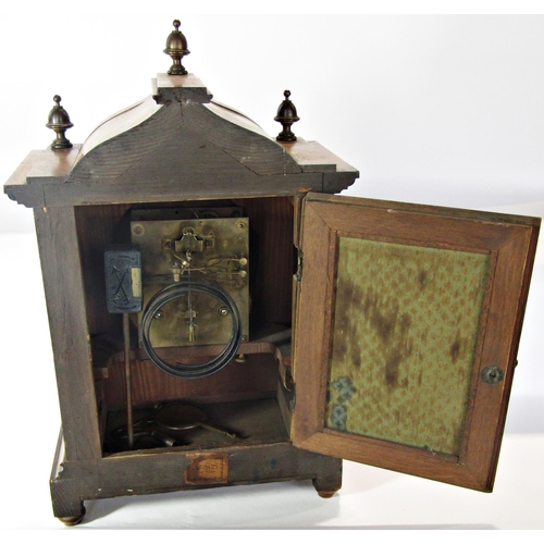 1489 - A late 19th century German bracket clock with walnut case, broken arch dial and Ting Tang strike