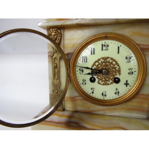 1490 - A Victorian onyx mantel clock with applied gilt mounts containing an eight day striking movement