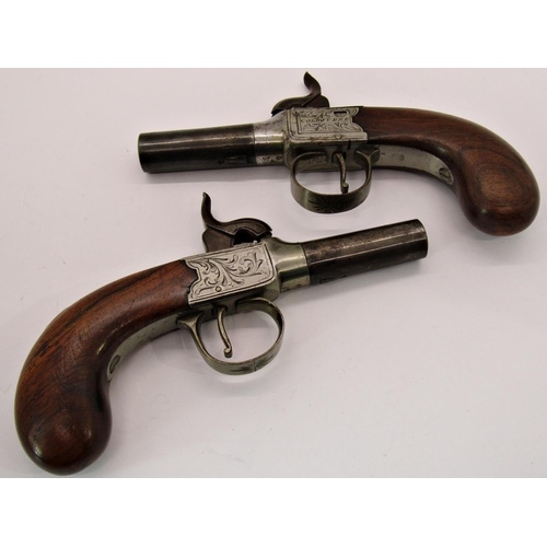 1543 - A pair of Georgian pocket pistols with walnut group, percussion cap action and detachable barrels by... 