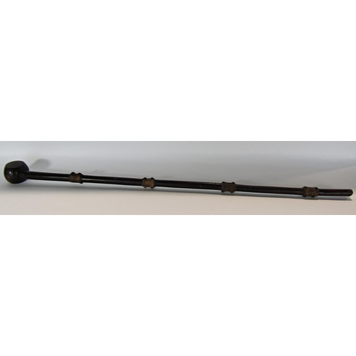 1641 - A rudimentary African walking stick with studded and leather sections, 86 cm long