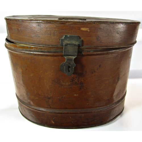 1644 - An oval tin hat box containing one pair of athletes running spikes and one pair of vintage football ... 