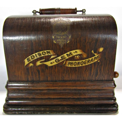 1653 - An Edison Gem phonograph in its original oak carrying case with its original crank and a selection o... 