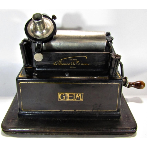 1653 - An Edison Gem phonograph in its original oak carrying case with its original crank and a selection o... 