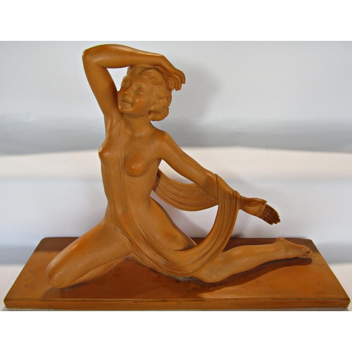 1674 - An Art Deco terracotta statue of a semi naked female dancer with an indistinct foundry mark and indi... 