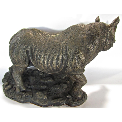 1677 - A bronze resin statue of a rhinoceros, signed B H Hollinger, 50cm wide approx