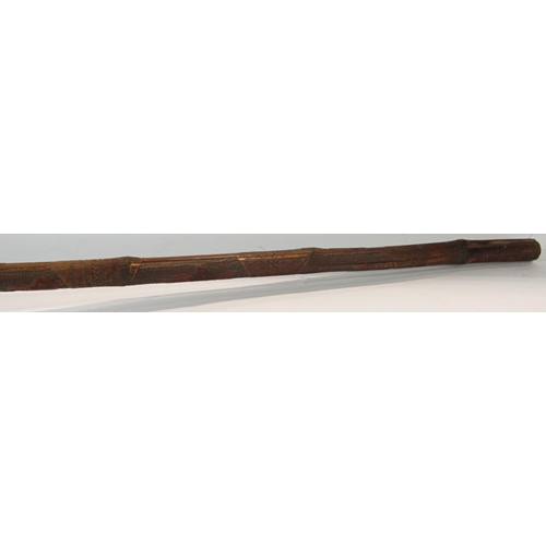 1682 - A intricately carved South East Asian bamboo pole 195cm long together with an ebony walking cane, an... 