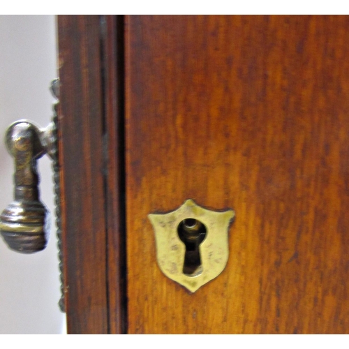 1705 - A Victorian oak smokers cabinet with a full glazed door revealing three drawers and three mixing pla... 