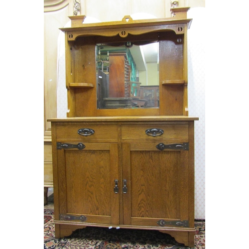 2685 - A small oak arts and crafts dresser, the lower section with two panelled doors and two frieze drawer... 