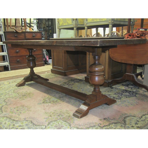 2699 - An Old English style refectory table, the heavy plank top with cleated ends, raised on a pair of blu... 