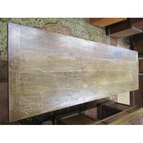 2699 - An Old English style refectory table, the heavy plank top with cleated ends, raised on a pair of blu... 