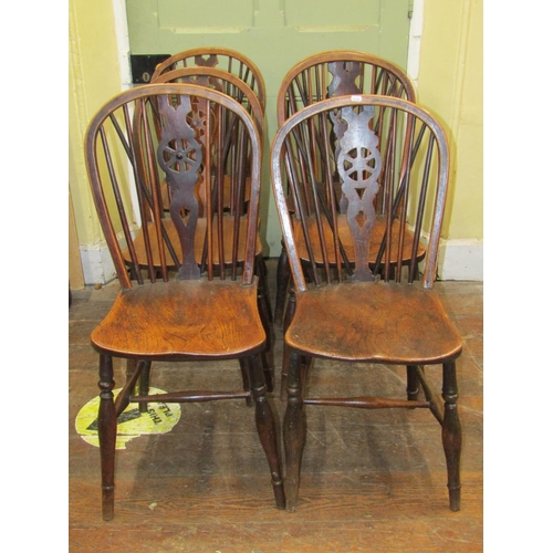 2700 - Ten antique Windsor wheelback dining chairs principally in elm, ash and beech (these chairs stood an... 