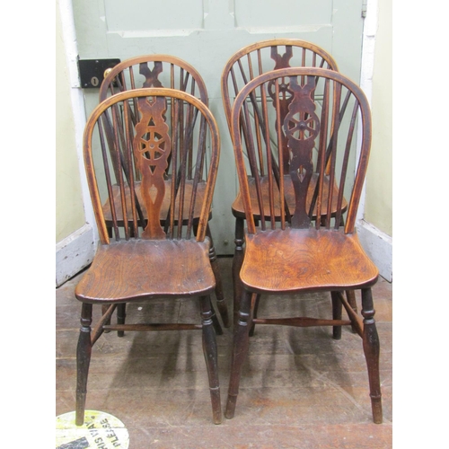 2700 - Ten antique Windsor wheelback dining chairs principally in elm, ash and beech (these chairs stood an... 