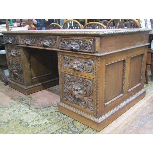 2708 - A good quality mid Victorian period oak pedestal desk enclosing an arrangement of eight frieze drawe... 