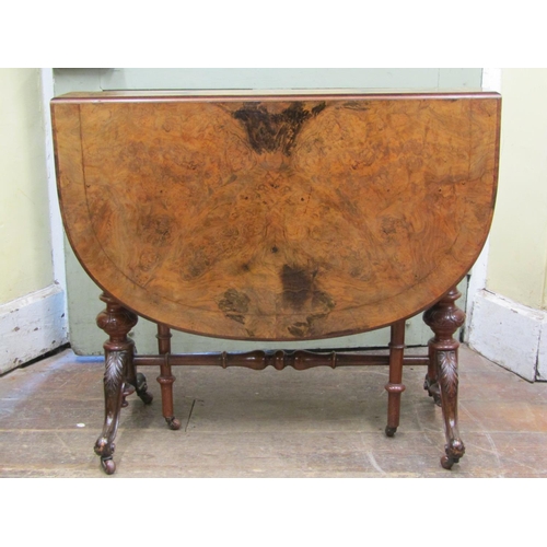 2712 - A Victorian figured walnut Sutherland tea table on carved supports, the top with simple inlaid detai... 