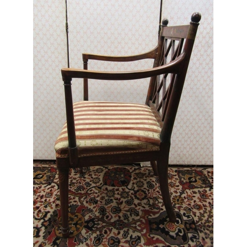 2734 - A Regency countrymade elbow chair with lattice work back and upholstered seat, the frame with painte... 