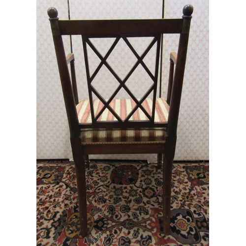 2734 - A Regency countrymade elbow chair with lattice work back and upholstered seat, the frame with painte... 