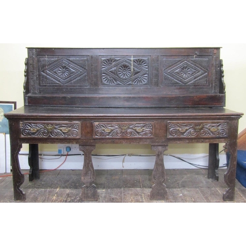 2737 - An old English dresser fitted with three frieze drawers on shaped supports with raised and panelled ... 