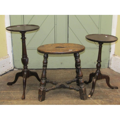 2739 - A 19th century stool principally in elm on four turned supports united by an X shaped stretcher, tog... 