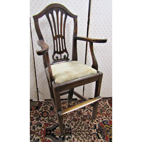 2748 - A Georgian spindle back elbow chair in ash wood, with rush seat on pad feet, with a Georgian elm chi... 