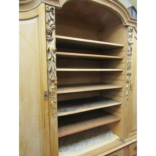 2755 - 19th century stripped and waxed pine cupboard, the lower section enclosed by a series of drawers ove... 