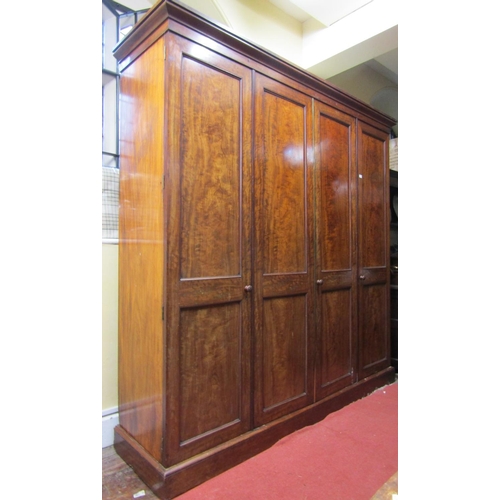 2756 - A good quality Georgian mahogany four door wardrobe, the interior comprehensively fitted with enclos... 