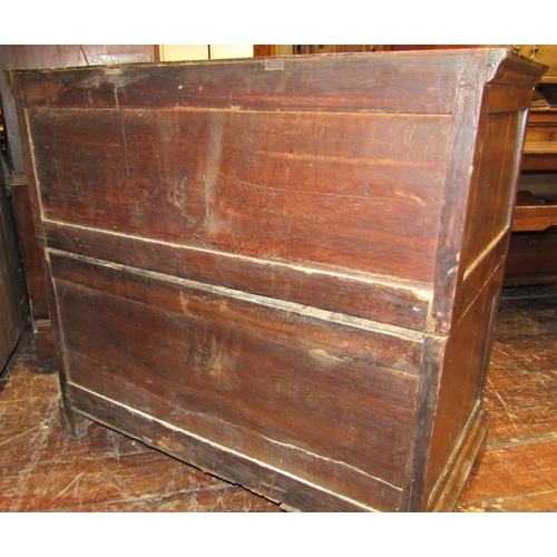 2764 - An antique countrymade chest of four long drawers, the carcass in two sections with figured walnut f... 