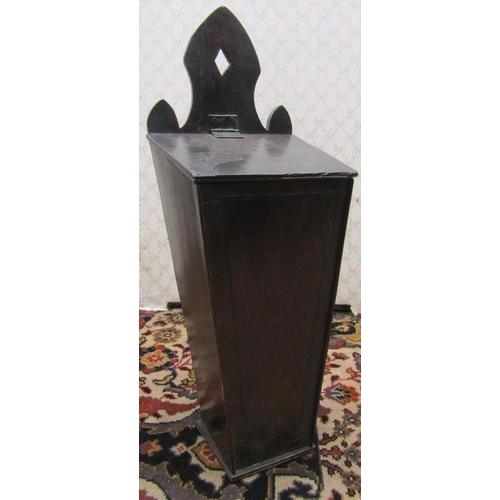 2765 - A Georgian oak wall mounted square cut candle box, with shaped back