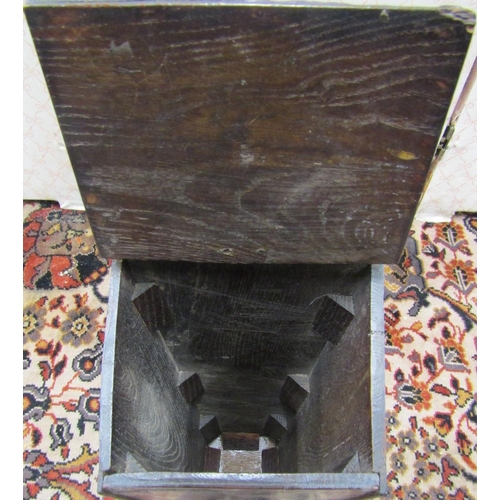 2765 - A Georgian oak wall mounted square cut candle box, with shaped back