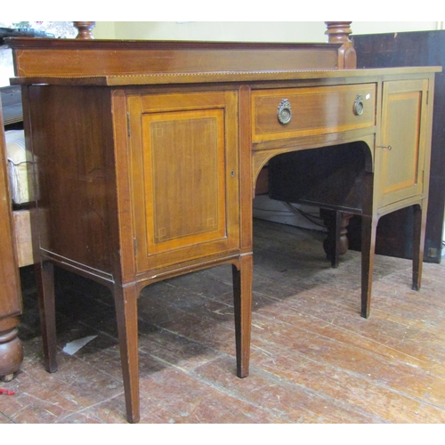 2768 - An inlaid Edwardian mahogany sideboard in the Georgian style, with serpentine outline, chequered str... 