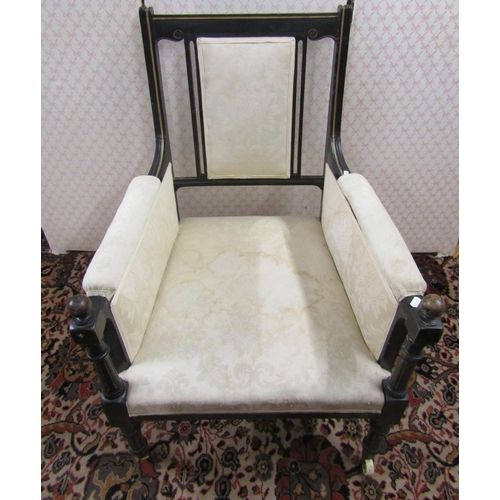 2770 - An aesthetic movement library of drawing room chair, with ebonised frame, gilt detail and upholstere... 