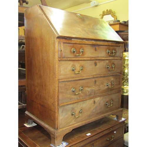 2775 - A small Georgian mahogany oak lined bureau, the front elevation enclosed by four long graduated draw... 