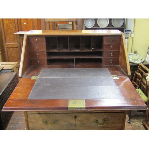 2775 - A small Georgian mahogany oak lined bureau, the front elevation enclosed by four long graduated draw... 