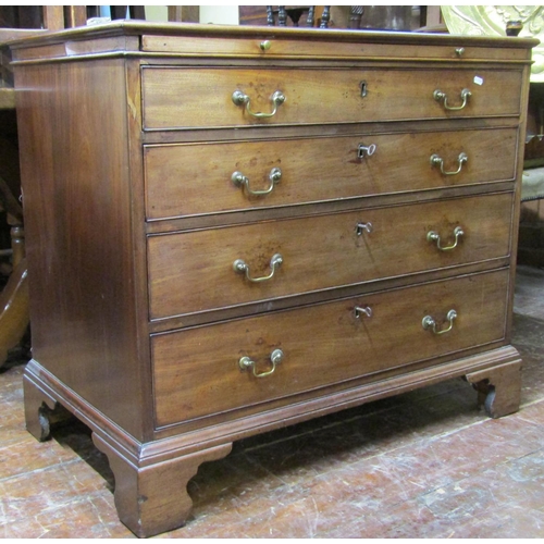 2776 - A Georgian mahogany and oak lined chest of four long graduated drawers enclosing a brush slide, the ... 