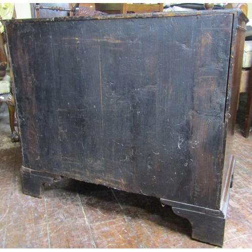 2776 - A Georgian mahogany and oak lined chest of four long graduated drawers enclosing a brush slide, the ... 