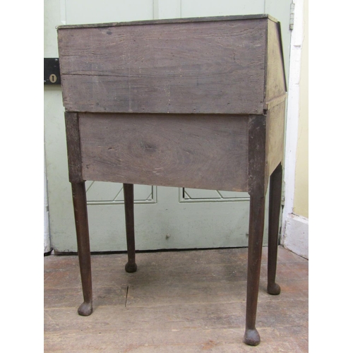 2780 - A Georgian oak and rippled oak countrymade writing bureau of simple form, the fall flap over a friez... 