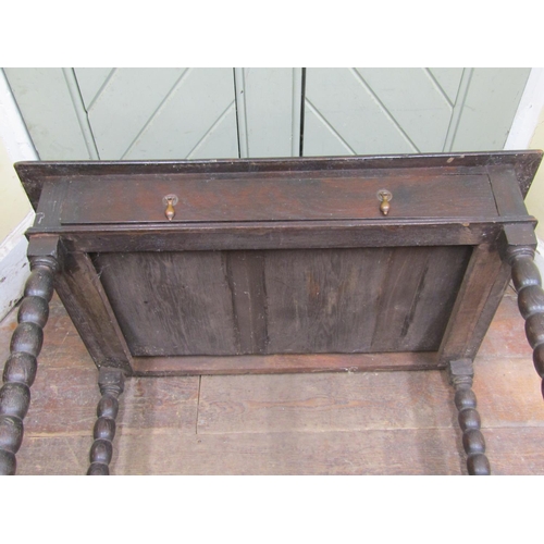 2781 - An early Georgian oak side table with frieze drawer on bobbin moulded supports, 90cm wide