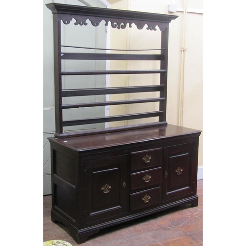 2810 - Small oak cottage dresser the base enclosed by three drawers and two cupboards set beneath a plate r... 