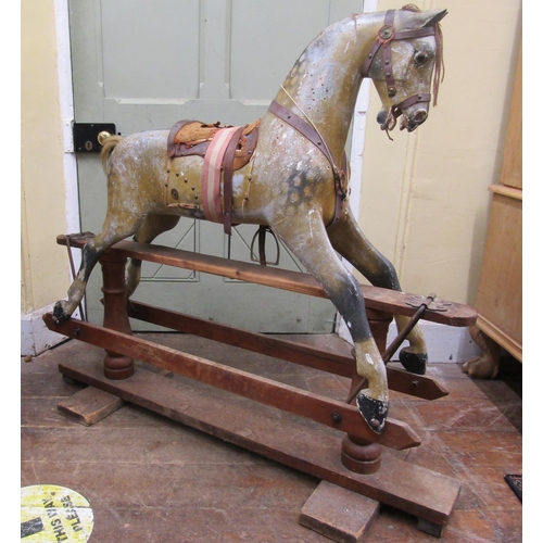 2811 - An Edwardian dapple grey rocking horse in original condition on pie rocker, 112cm high x 127cm long