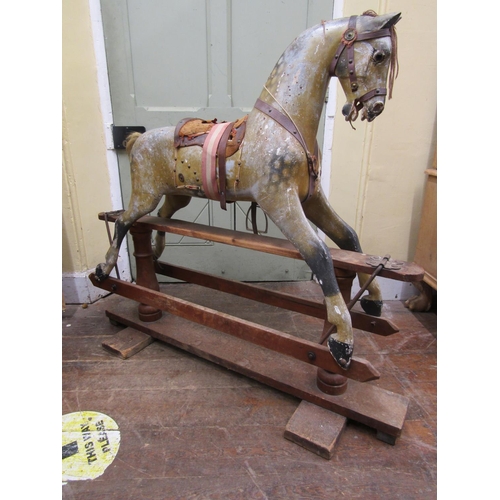 2811 - An Edwardian dapple grey rocking horse in original condition on pie rocker, 112cm high x 127cm long