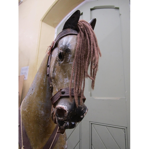 2811 - An Edwardian dapple grey rocking horse in original condition on pie rocker, 112cm high x 127cm long