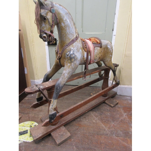 2811 - An Edwardian dapple grey rocking horse in original condition on pie rocker, 112cm high x 127cm long