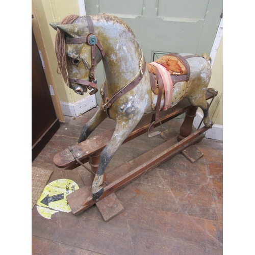 2811 - An Edwardian dapple grey rocking horse in original condition on pie rocker, 112cm high x 127cm long