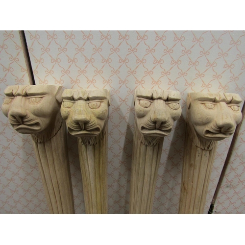 2691 - Four carved hardwood column supports with lion mask and lions paw feet, 58cm high