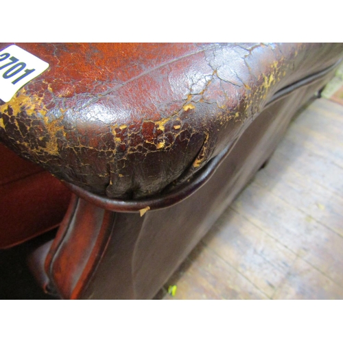 2701 - A pair of late Edwardian club chairs, the framework upholstered in maroon leather with later upholst... 